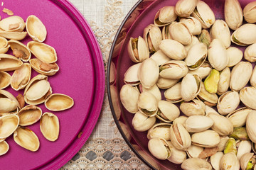 A shot from top, pistachios in purple bowl. 
