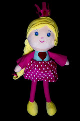 Cute princess doll isolated on black background.