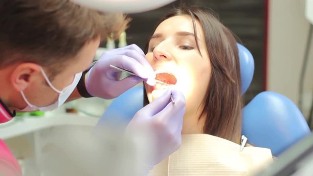 The examination of the oral cavity in a dental clinic