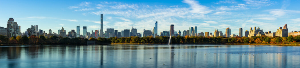 Morning panoramic view of Midtown Manhattan skyscrapers and the Central Park Reservoir in Fall. New York City