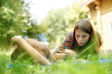 young woman mehendi artist painting henna on the hand