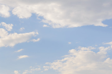 White fluffy clouds in  blue sky and copyspace for backgrounds