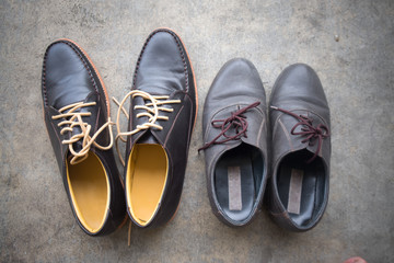 Two different Pairs of brown classic modern shoes