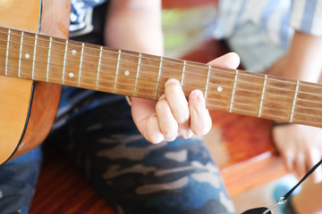 Fototapeta premium Musician playing acoustic guitar