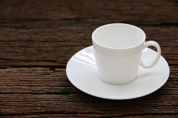 White coffee cup on old wood table. copyspace for your text