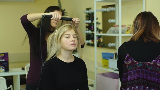 girl doing makeup and hair