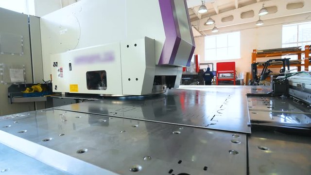 Punching cnc machine working. Modern Industrial equipment at a factory. 4K.