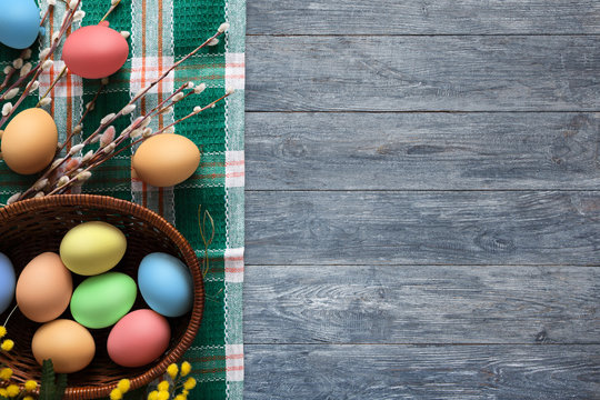 Colorful easter eggs on wood background