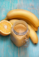 Smoothies orange banana in a mason jar