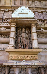 Sculpture in a window on the temple Khajuraho.