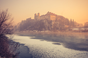 Krakow, Poland, Tyniec abbey in the morning over frozen Vistula river,