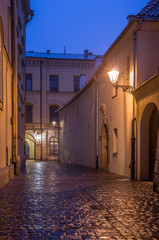 Krakow, Poland, old town street paved with cobblestones during rainy night