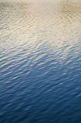 Photo of blue water background surface with ripples