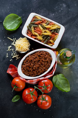 Top view of italian traditional components for making pasta bolognese