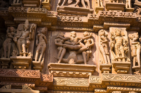 Famous historic monumant with erotic theme on sculptured wall of indian temple of Khajuraho.