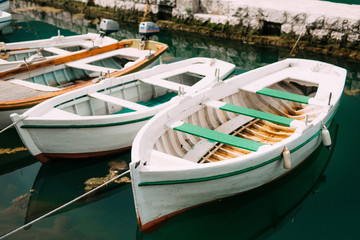 Fototapeta na wymiar Wooden boats on the water. In the Bay of Kotor in Montenegro. Marine boats.