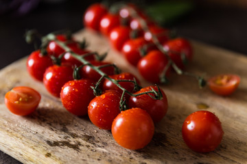 Close up cherries on wooden cutting board