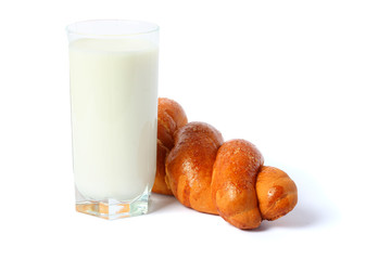 glass of milk with bread isolated on white background