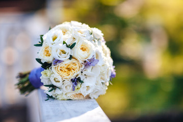 bride's bouquet lies in the nature on a green background