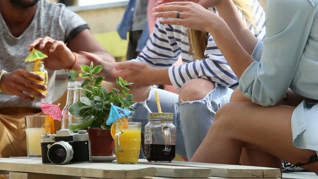View of table full of colorful cocktails at rooftop party