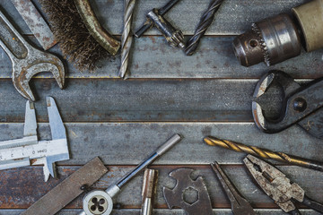 Old tool on rusty old metal slats. Copyspace