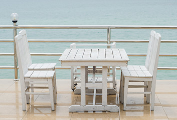 Fototapeta na wymiar Restaurant tables served on the beach