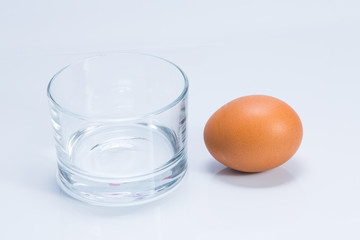 Egg in glass isolated on white background