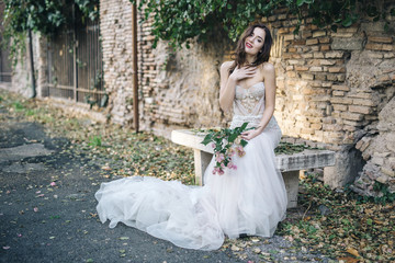 Bride fashion with romantic flower bouquet in Rome