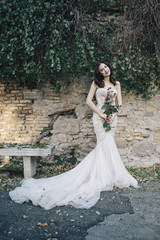 Bride fashion with romantic flower bouquet in Rome