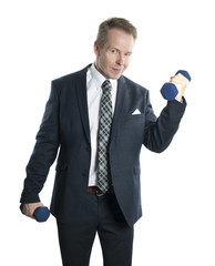 Business man doing exercises with dumbbells in suit. Isolated on white background.