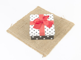 red gift box, with ribbon and Christmas decoration
