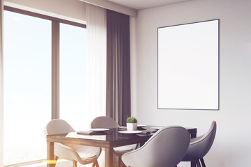 Dark kitchen with table and poster, closeup, toned