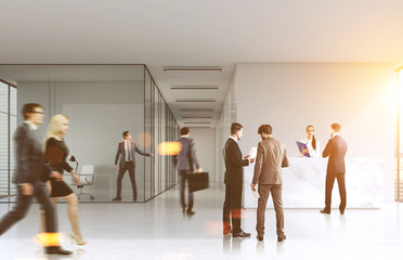 People walking in an office lobby