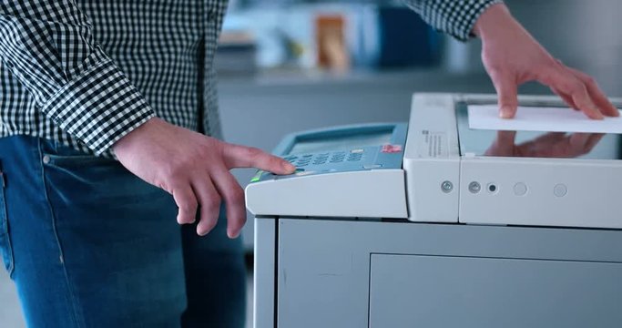  assistant makes copies of files in the copy machine