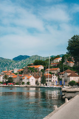 Fototapeta na wymiar The old town of Perast on the shore of Kotor Bay, Montenegro. The ancient architecture of the Adriatic and the Balkans. Fishermen's cities of Europe.
