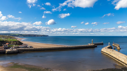 Fototapeta premium Whitby pier and beach, North Yorkshire, UK