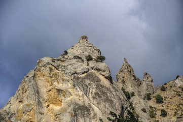 Russia, peninsula of Crimea, village of Sun Valley. Picturesque rocks around the village on a background of the autumn sky.