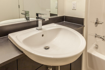 Fototapeta na wymiar overhanging sink in modern white bathroom