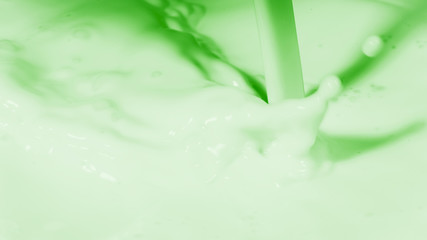 Photo of liquid consistency of milk in green color