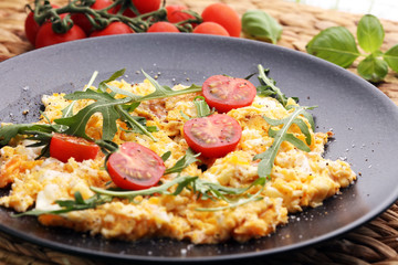 Traditional breakfast - fried eggs,ruccola, tommato- - diet concept scrambled eggs