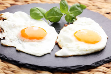 fried eggs with basil pepper and salt