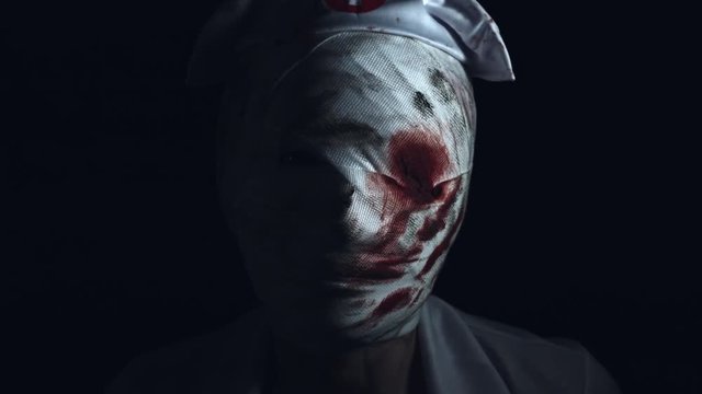 4k Horror Nurse Zombie Head Appearing from Dark