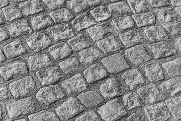 boots on the cobblestones close-up. white and black color