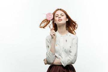 happy woman with a lollipop in her hand