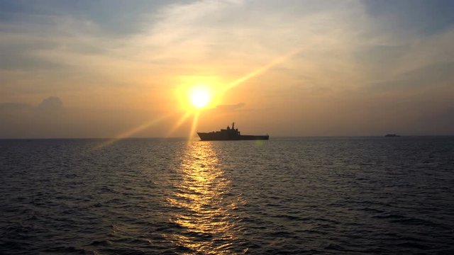 Military Vessel at Sunset