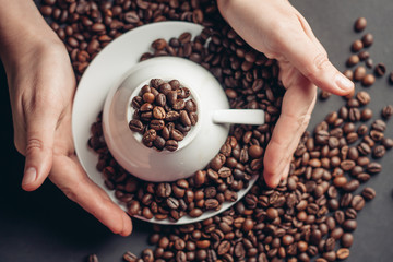 inverted mug, saucers and coffee beans
