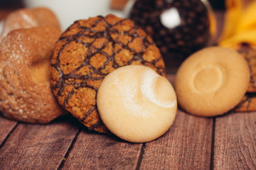 oatmeal cookies with chocolate and dessert on a wooden background