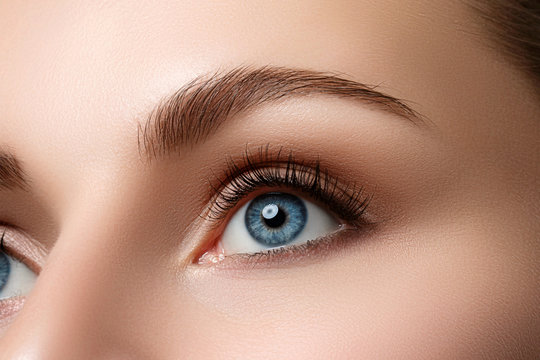 Close up view of beautiful blue female eye
