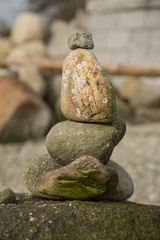 Fototapeta na wymiar Concept meditation green pebbles pyramid