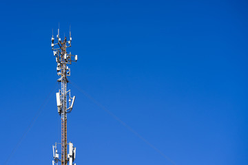 the cell tower operator on the blue sky